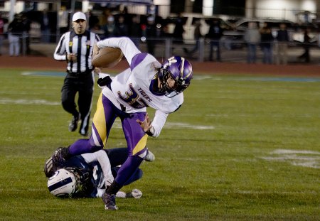 Tigers put up a good fight in title game, but Central Valley Christian holds on for a 27-26 victory Tiger quarterback Alden McDaniel breaking a tackle, turning a loss into a big gain .